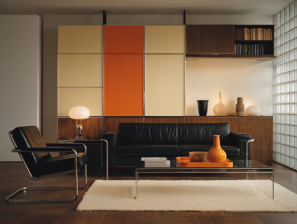 Modernist living room with modular wall panels in saffron and neutral tones, black leather seating, chrome cantilever chair, walnut shelving, and structured geometric composition