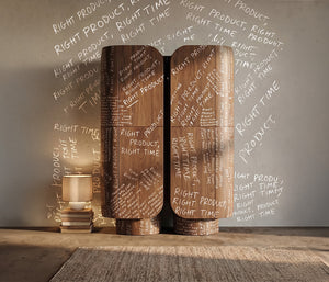 Wooden cylindrical objects with text on a neutral background