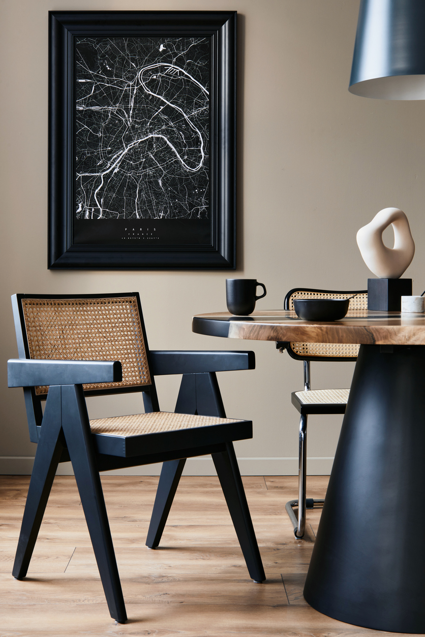 modern composition of dining room interior with design wooden table, stylish chairs, decoration, teapot, cups, vessel, commode, black mock up poster map and elegant accessories in home decor. template